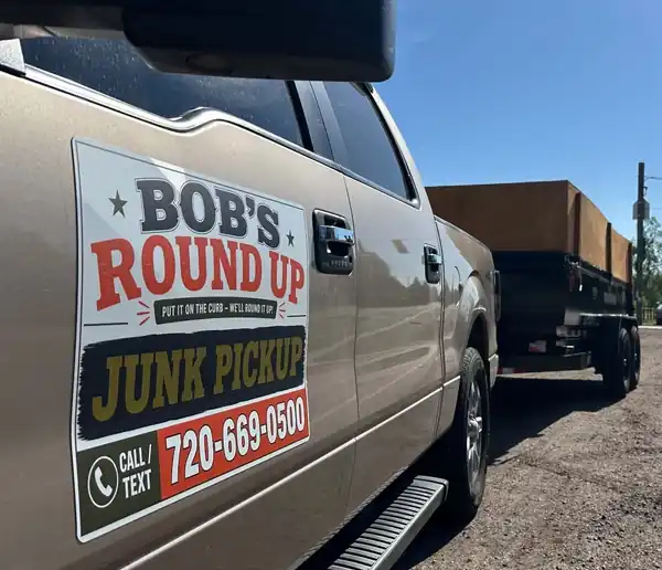 The Bob's Round Up pickup truck and dump trailer parked on a job in the Denver metro